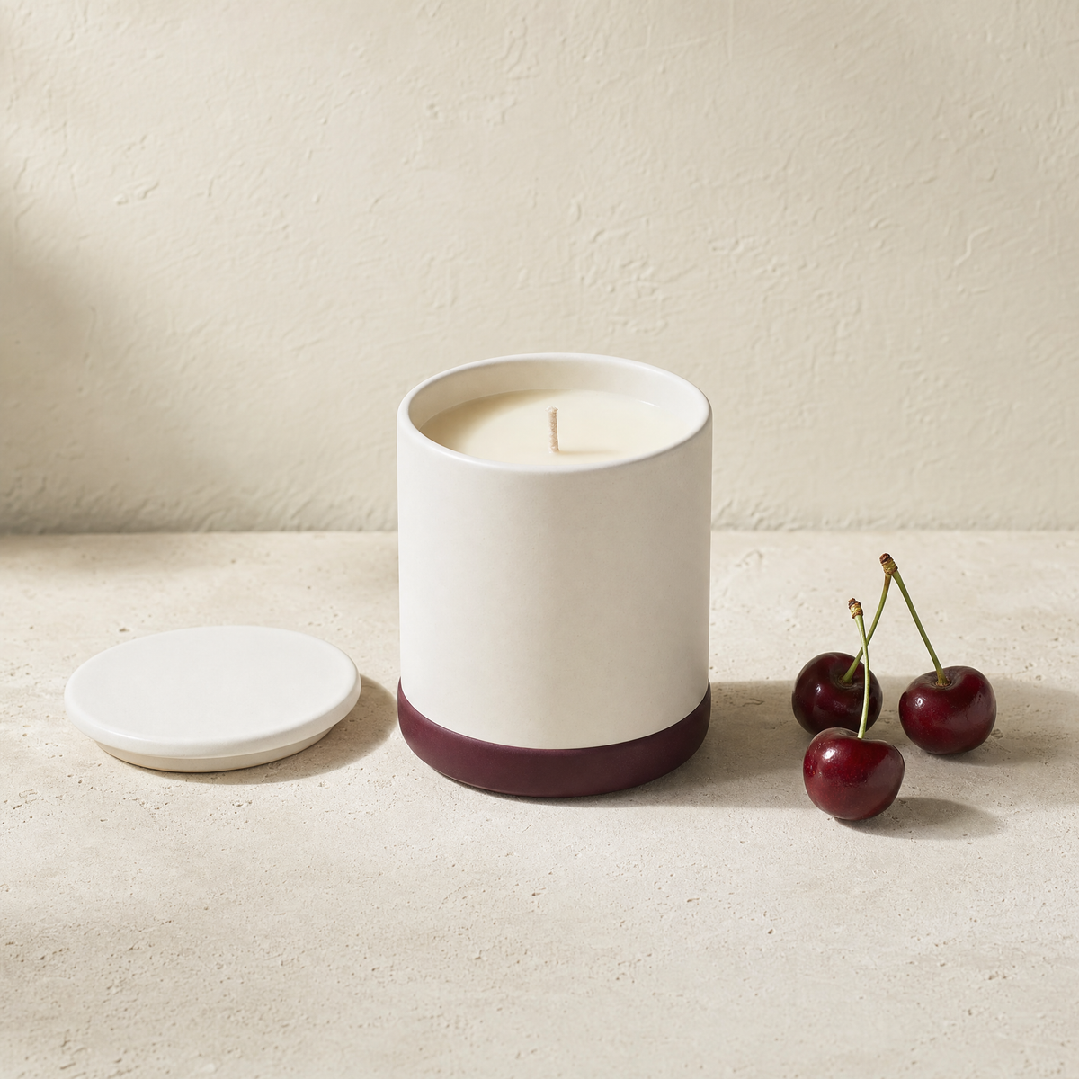 Dark cherry soy candle with three fresh cherries