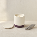Driftwood soy candle with a piece of weathered driftwood