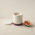 Fig soy candle with a halved fresh fig