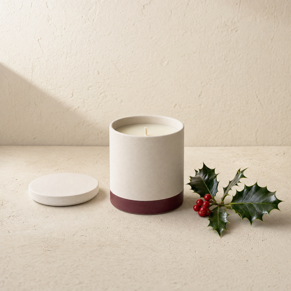 Holly berry soy candle with a holly sprig and red berries